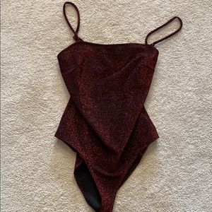 Sparkly red body suit